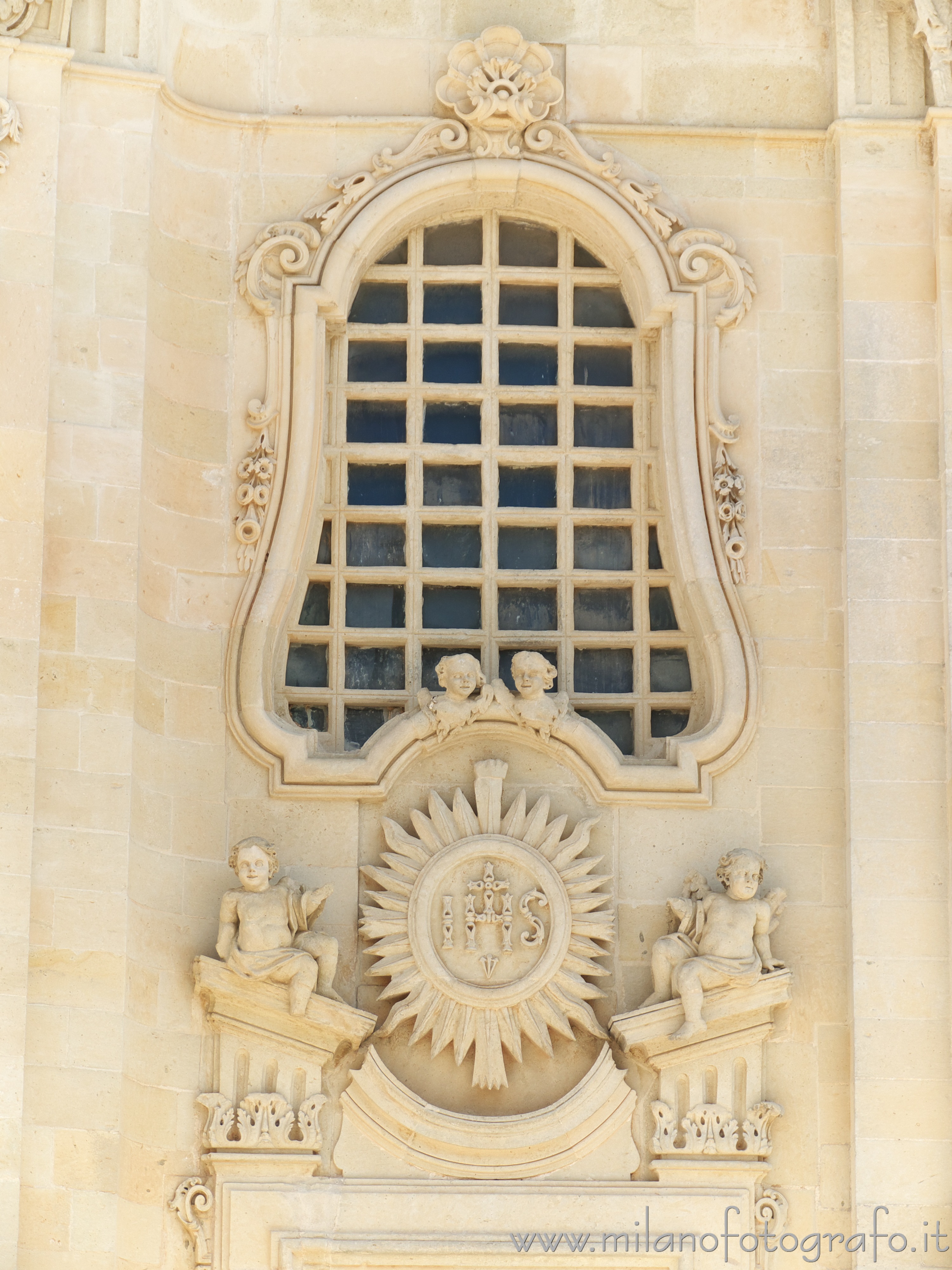 Uggiano La Chiesa (Lecce, Italy) - Baroque decorations above one side entrance of the Church of Santa Maria Maddalena